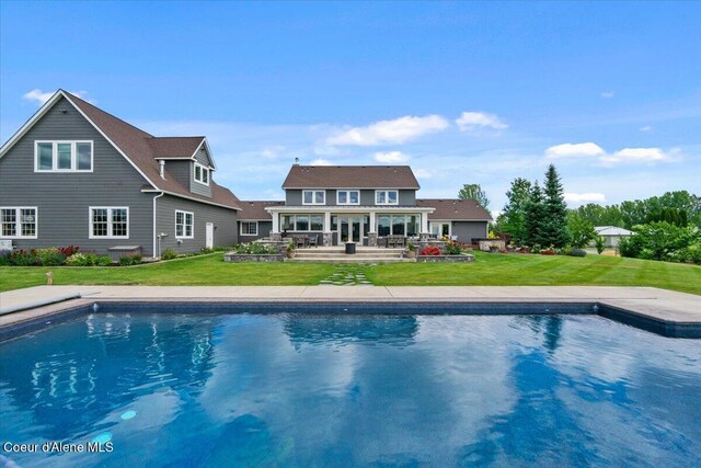 6744 E Greta Ave, Post Falls, ID 83854 - swimming pool featuring a patio and a yard