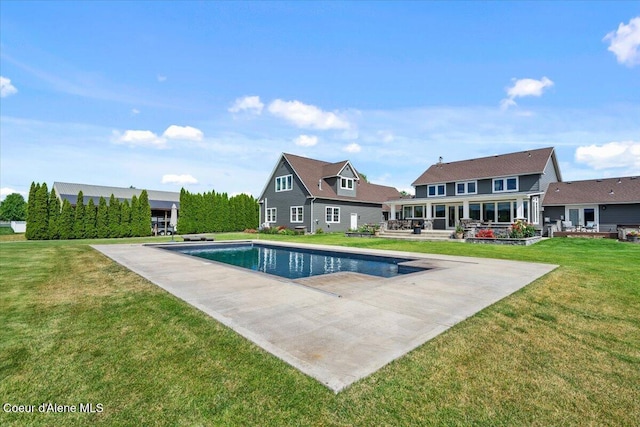 6744 E Greta Ave, Post Falls, ID 83854 - swimming pool featuring a patio area and a lawn