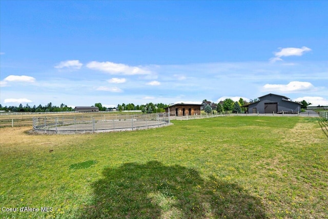 6744 E Greta Ave, Post Falls, ID 83854 - view of yard with an enclosed riding area, a view of rural / pastoral area, and an exterior structure