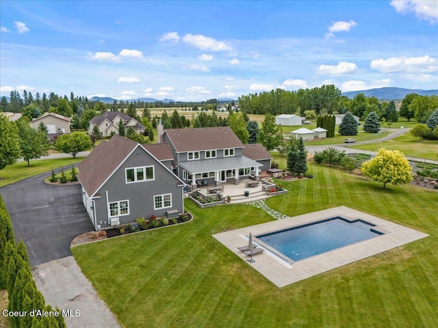 6744 E Greta Ave, Post Falls, ID 83854 - view from above of property featuring a mountain backdrop and a pool area