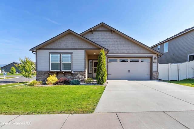 4574 N Connery Loop, Post Falls, ID 83854 - craftsman house featuring stone siding, a garage, and concrete driveway