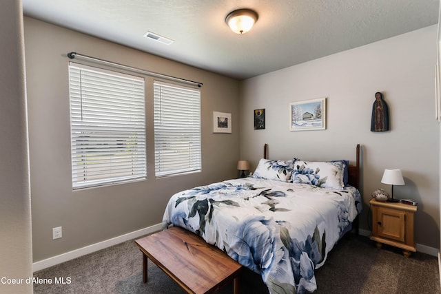 4574 N Connery Loop, Post Falls, ID 83854 - bedroom featuring dark colored carpet and baseboards