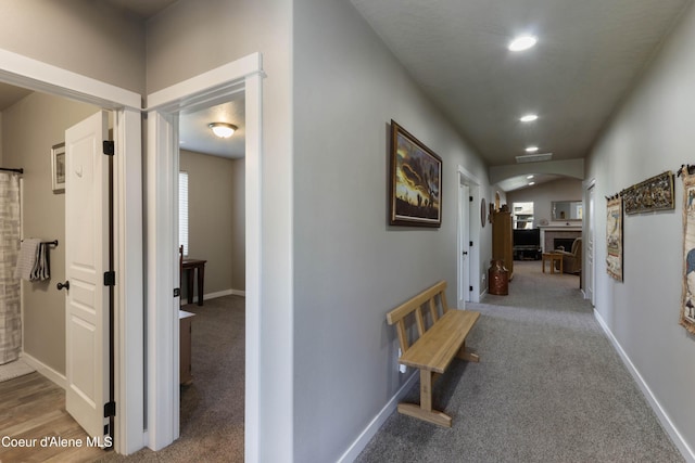 4574 N Connery Loop, Post Falls, ID 83854 - hallway featuring arched walkways, carpet, healthy amount of natural light, and recessed lighting