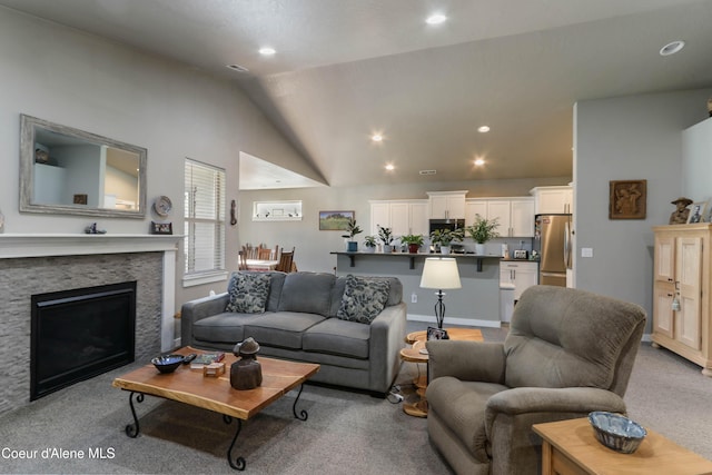 4574 N Connery Loop, Post Falls, ID 83854 - living area with light colored carpet, vaulted ceiling, recessed lighting, and a fireplace