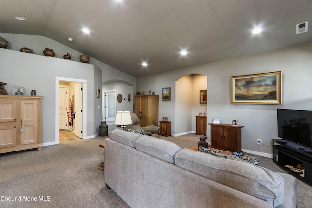 4574 N Connery Loop, Post Falls, ID 83854 - living area featuring arched walkways, light carpet, lofted ceiling, and recessed lighting