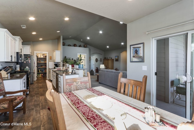 4574 N Connery Loop, Post Falls, ID 83854 - dining room with vaulted ceiling, dark wood-style floors, and recessed lighting