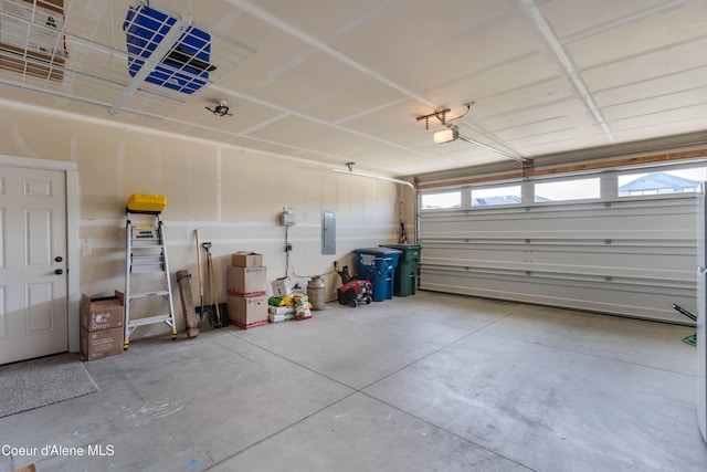 4574 N Connery Loop, Post Falls, ID 83854 - garage featuring electric panel and a garage door opener