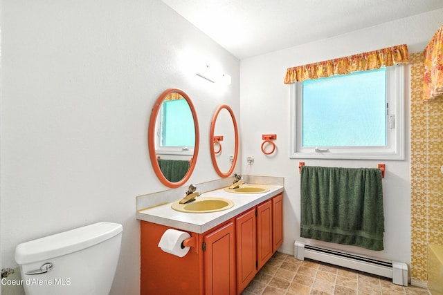 5678 N Pinegrove Dr, Coeur Dalene, ID 83815 - bathroom with a baseboard radiator and double vanity