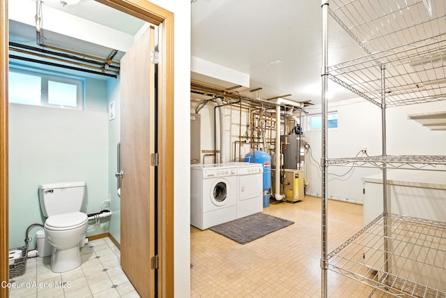5678 N Pinegrove Dr, Coeur Dalene, ID 83815 - laundry room with gas water heater, separate washer and dryer, plenty of natural light, and tile patterned floors