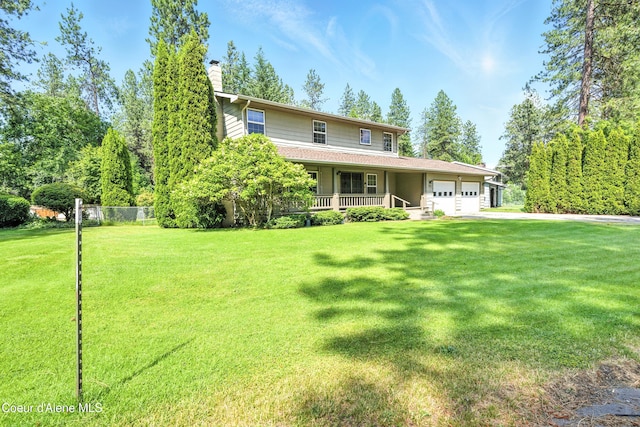 5678 N Pinegrove Dr, Coeur Dalene, ID 83815 - country-style home featuring a porch, an attached garage, a chimney, and a front yard