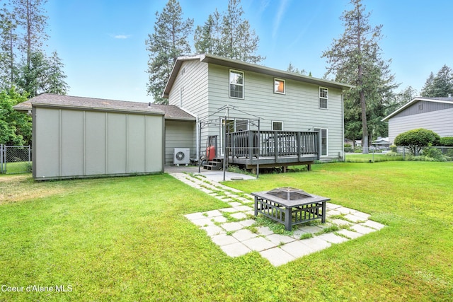 5678 N Pinegrove Dr, Coeur Dalene, ID 83815 - back of house with an outdoor fire pit, a patio area, and a wooden deck