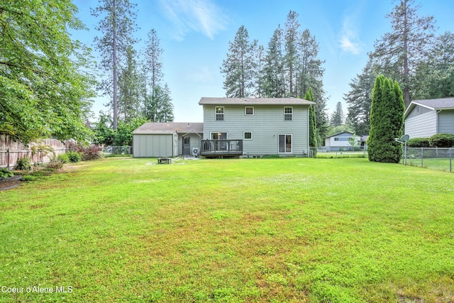 5678 N Pinegrove Dr, Coeur Dalene, ID 83815 - back of house featuring a fenced backyard and a wooden deck