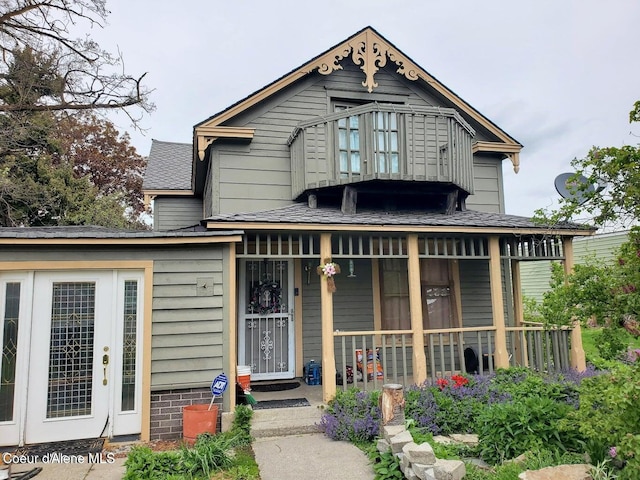 503 E 3rd Ave, Post Falls, ID 83854 - view of front of home with covered porch and a shingled roof