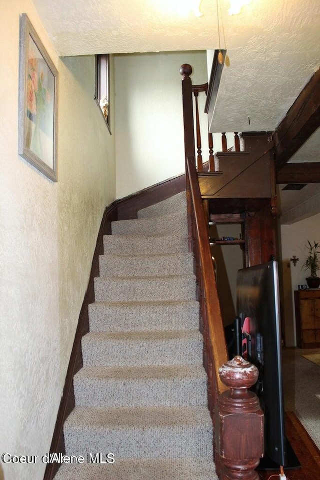 503 E 3rd Ave, Post Falls, ID 83854 - staircase featuring a textured wall