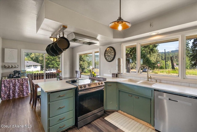 29603 S 3rd St, Worley, ID 83876 - kitchen featuring green cabinets, stainless steel appliances, light countertops, and healthy amount of natural light