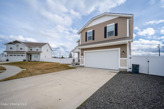 3664 W Belgrave Way, Hayden, ID 83835 - view of front of property featuring a gate, driveway, and an attached garage