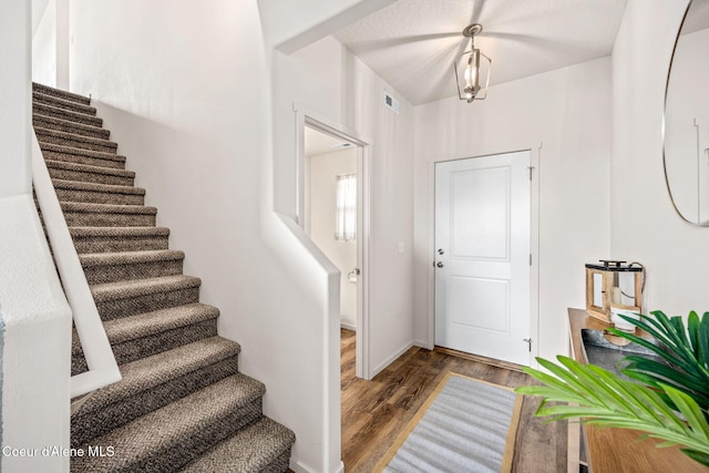 3664 W Belgrave Way, Hayden, ID 83835 - foyer with stairway and wood finished floors