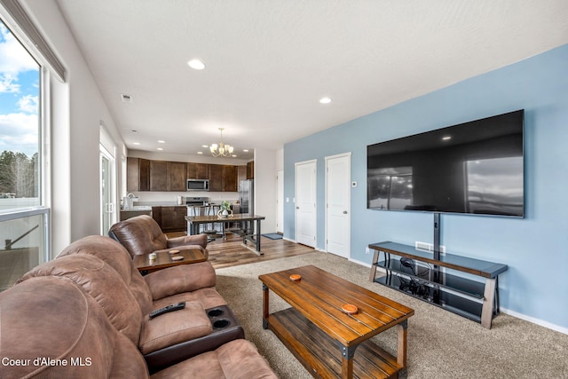 3664 W Belgrave Way, Hayden, ID 83835 - living room featuring a chandelier, recessed lighting, and carpet
