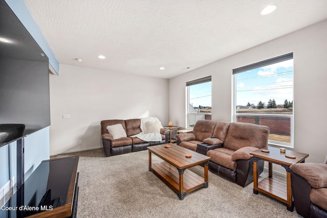 3664 W Belgrave Way, Hayden, ID 83835 - living room featuring light colored carpet, recessed lighting, and a textured ceiling
