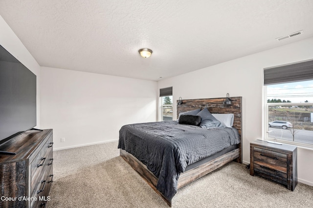 3664 W Belgrave Way, Hayden, ID 83835 - bedroom featuring light colored carpet and a textured ceiling