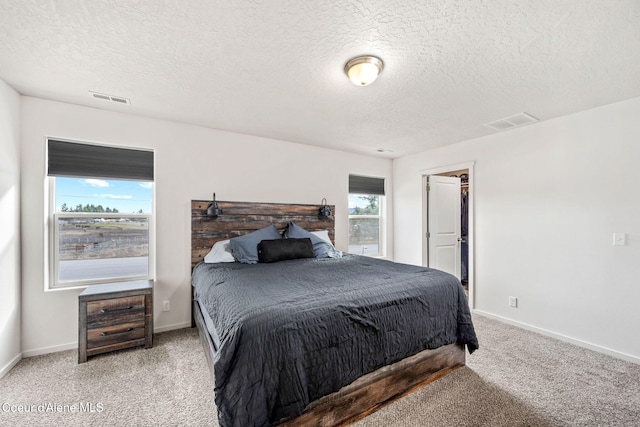 3664 W Belgrave Way, Hayden, ID 83835 - carpeted bedroom featuring a textured ceiling and baseboards