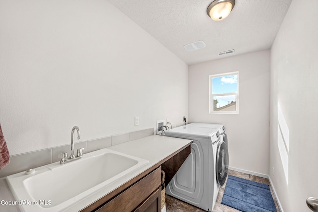 3664 W Belgrave Way, Hayden, ID 83835 - laundry area featuring independent washer and dryer, cabinet space, and a textured ceiling