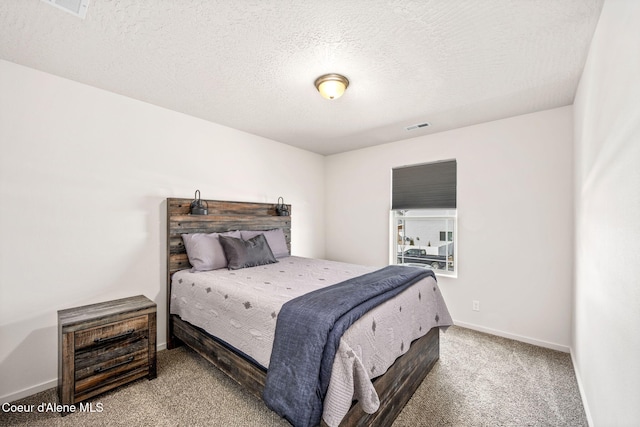 3664 W Belgrave Way, Hayden, ID 83835 - carpeted bedroom featuring baseboards and a textured ceiling