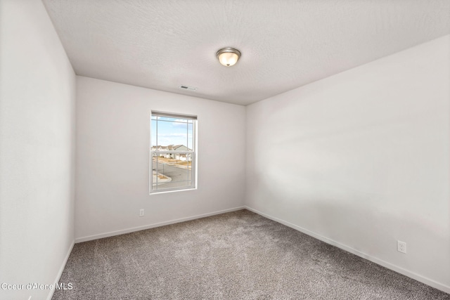 3664 W Belgrave Way, Hayden, ID 83835 - carpeted empty room featuring baseboards and a textured ceiling