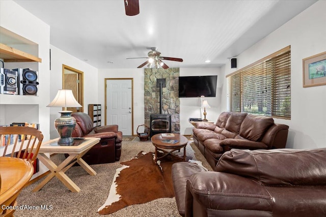 174 Where Its At Rd, Athol, ID 83801 - carpeted living area with a wood stove and a ceiling fan