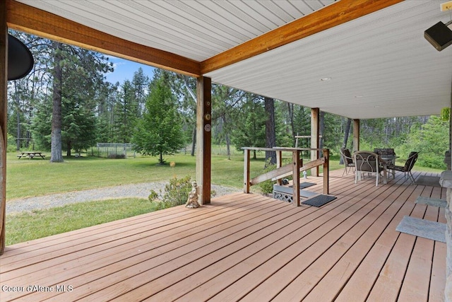 174 Where Its At Rd, Athol, ID 83801 - wooden terrace featuring view of wooded area and outdoor dining area