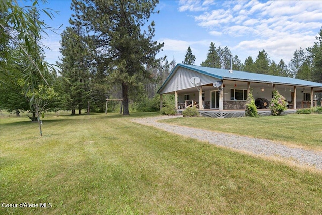 174 Where Its At Rd, Athol, ID 83801 - view of front of home with a porch, a front yard, and driveway