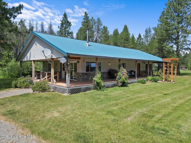 174 Where Its At Rd, Athol, ID 83801 - back of house featuring a lawn, stone siding, and a metal roof