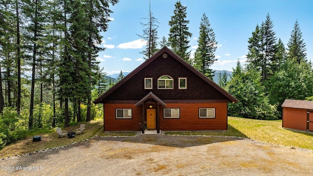 1911 Carr Creek Rd, Sandpoint, ID 83864 - rustic home featuring a mountain view and a shed