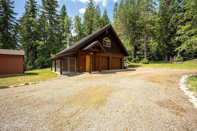 1911 Carr Creek Rd, Sandpoint, ID 83864 - view of front of house featuring an outbuilding and a detached garage