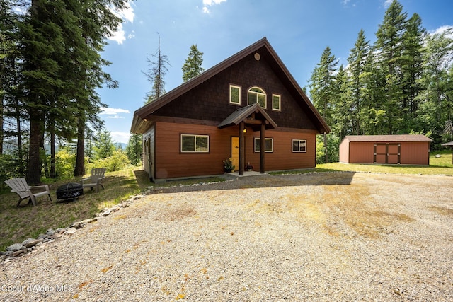 1911 Carr Creek Rd, Sandpoint, ID 83864 - rustic home featuring a fire pit and a storage unit