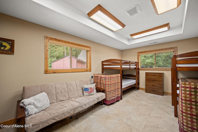 1911 Carr Creek Rd, Sandpoint, ID 83864 - bedroom with a tray ceiling and baseboards