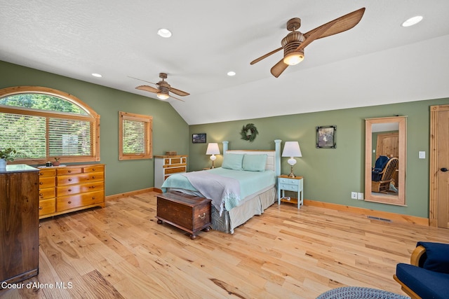 1911 Carr Creek Rd, Sandpoint, ID 83864 - bedroom featuring lofted ceiling, wood finished floors, recessed lighting, and a ceiling fan