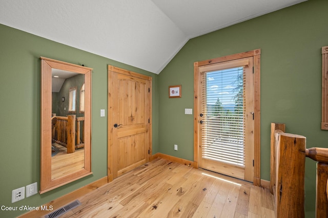 1911 Carr Creek Rd, Sandpoint, ID 83864 - entryway featuring vaulted ceiling and light wood-style floors