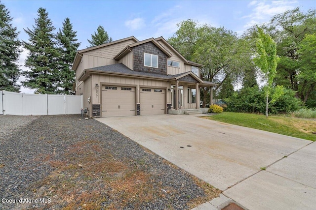 1877 W Orchard Ave, Hayden, ID 83835 - craftsman-style house with a gate, board and batten siding, and concrete driveway