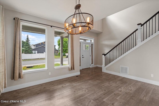 1877 W Orchard Ave, Hayden, ID 83835 - foyer entrance with a chandelier, stairs, and wood finished floors
