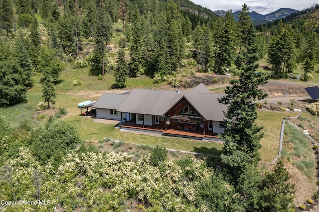 1010 Mc Quade Gulch Dr, Clark Fork, ID 83811 - view of subject property featuring a heavily wooded area and a mountainous background