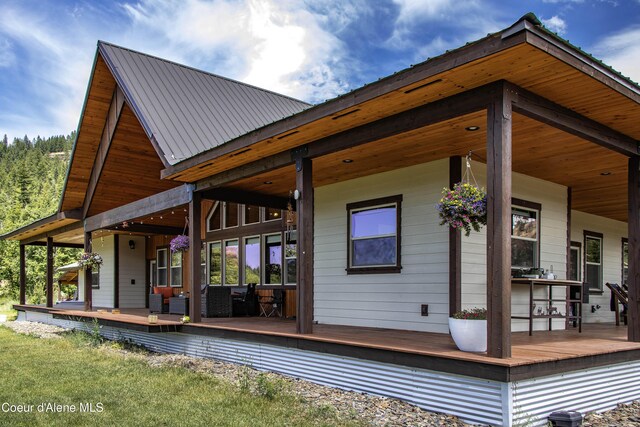 1010 Mc Quade Gulch Dr, Clark Fork, ID 83811 - rear view of property featuring a metal roof and a wooden deck