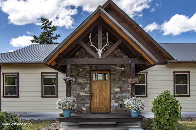 1010 Mc Quade Gulch Dr, Clark Fork, ID 83811 - view of exterior entry featuring a metal roof