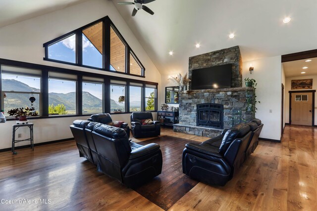 1010 Mc Quade Gulch Dr, Clark Fork, ID 83811 - living room with plenty of natural light, a ceiling fan, wood finished floors, recessed lighting, and high vaulted ceiling