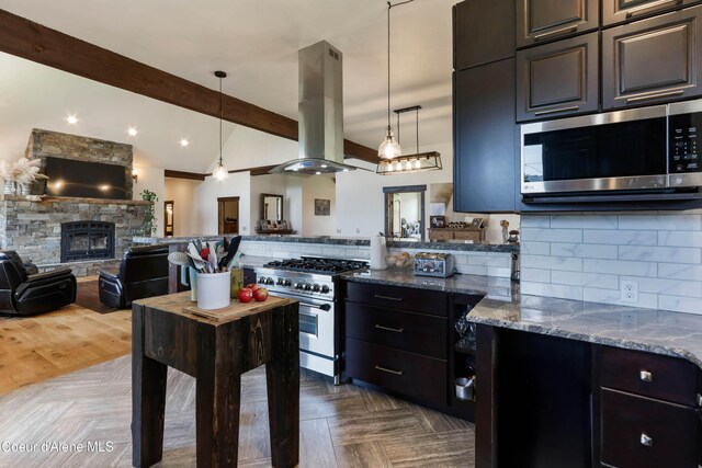 1010 Mc Quade Gulch Dr, Clark Fork, ID 83811 - kitchen with appliances with stainless steel finishes, island exhaust hood, open floor plan, dark stone counters, and backsplash