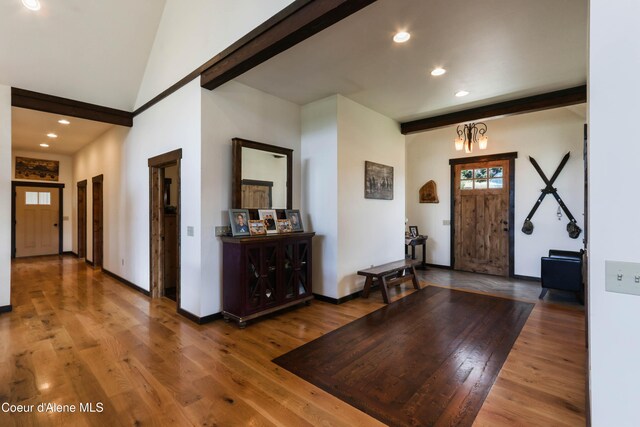 1010 Mc Quade Gulch Dr, Clark Fork, ID 83811 - foyer featuring recessed lighting, wood finished floors, a chandelier, and beam ceiling