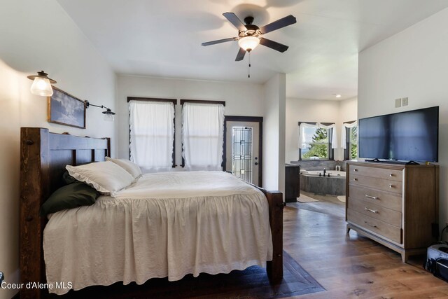 1010 Mc Quade Gulch Dr, Clark Fork, ID 83811 - bedroom featuring wood finished floors and a ceiling fan