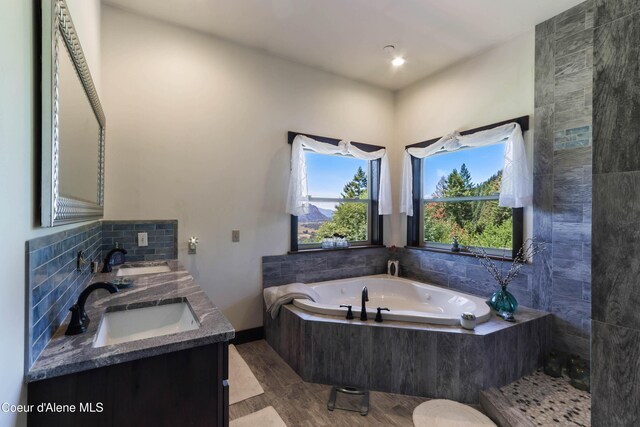 1010 Mc Quade Gulch Dr, Clark Fork, ID 83811 - bathroom with a bath and double vanity