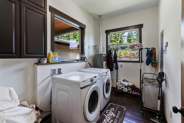 1010 Mc Quade Gulch Dr, Clark Fork, ID 83811 - laundry area with cabinet space, water heater, washing machine and clothes dryer, and plenty of natural light