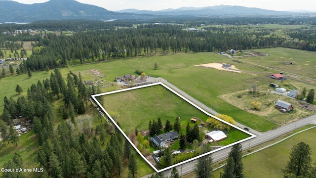 5570 E Dodd Rd, Hayden, ID 83835 - aerial view of property and surrounding area featuring property boundaries highlighted and rural landscape